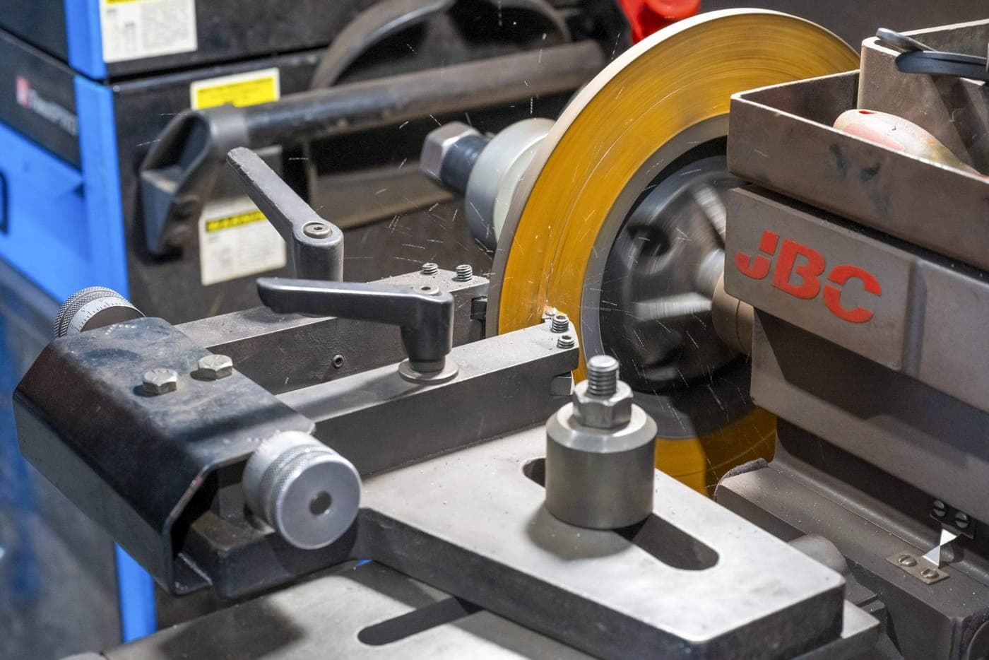 Brake disc mounted on the workshop lathe being machined