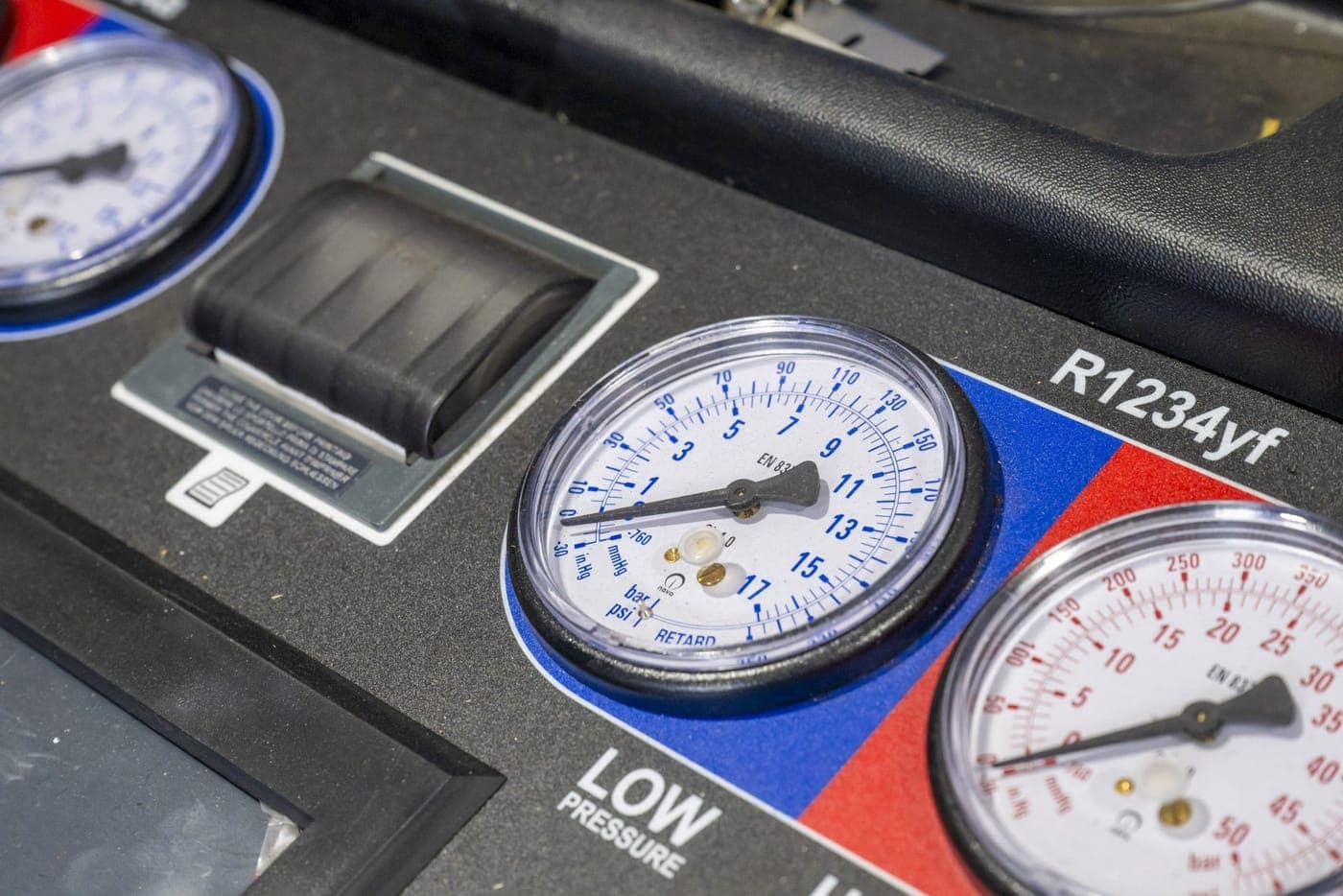 Air conditioning service gauges showing high and low side pressures