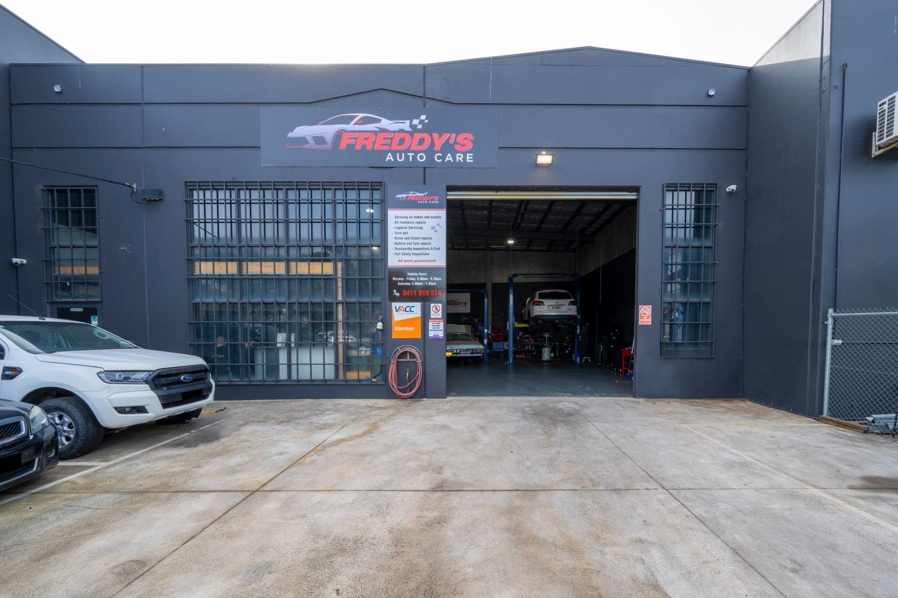 Exterior of the Freddy's Auto Care workshop with the roller door open