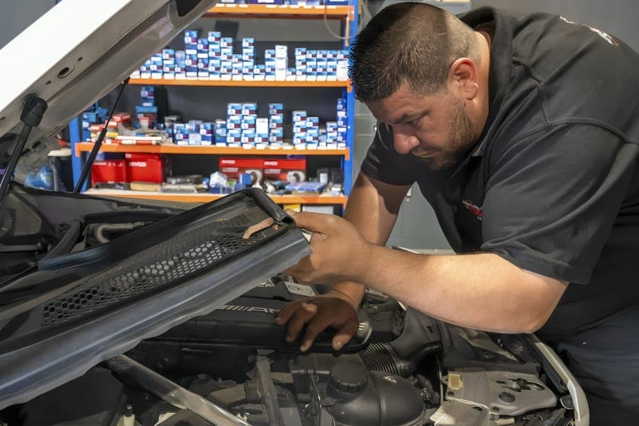 Mechanic at Freddy's Auto Care performing a logbook service on a vehicle in Craigieburn
