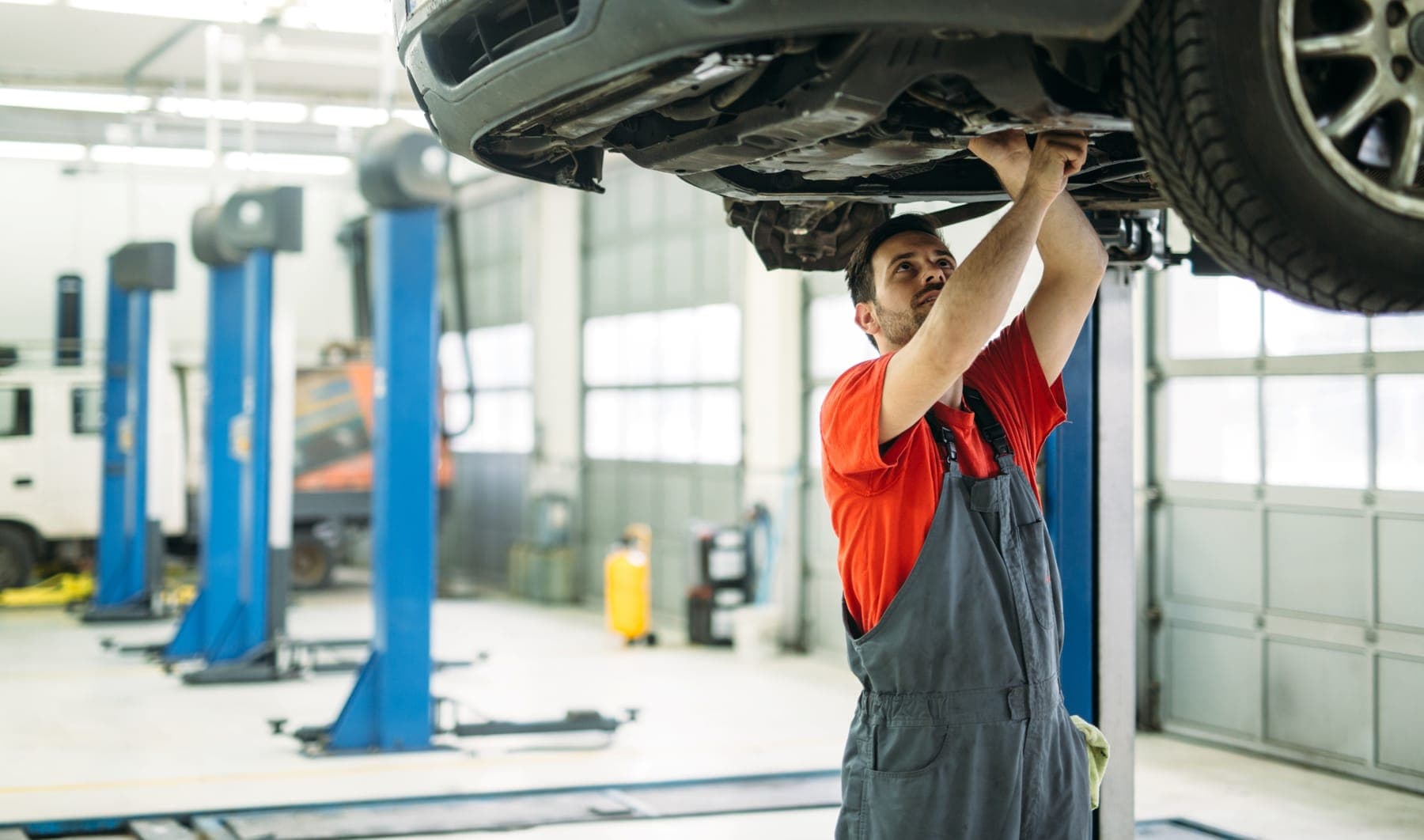 Technician working beneath a raised vehicle on drivetrain repairs at Freddy's Auto Care, Craigieburn